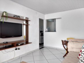 Casa com garagem e churrasqueira a 5 minutos da Praia Grande